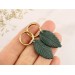 Minimalist golden hoop earrings Botanical jewelry for everyday Green leaf dangles Unique birthday gift